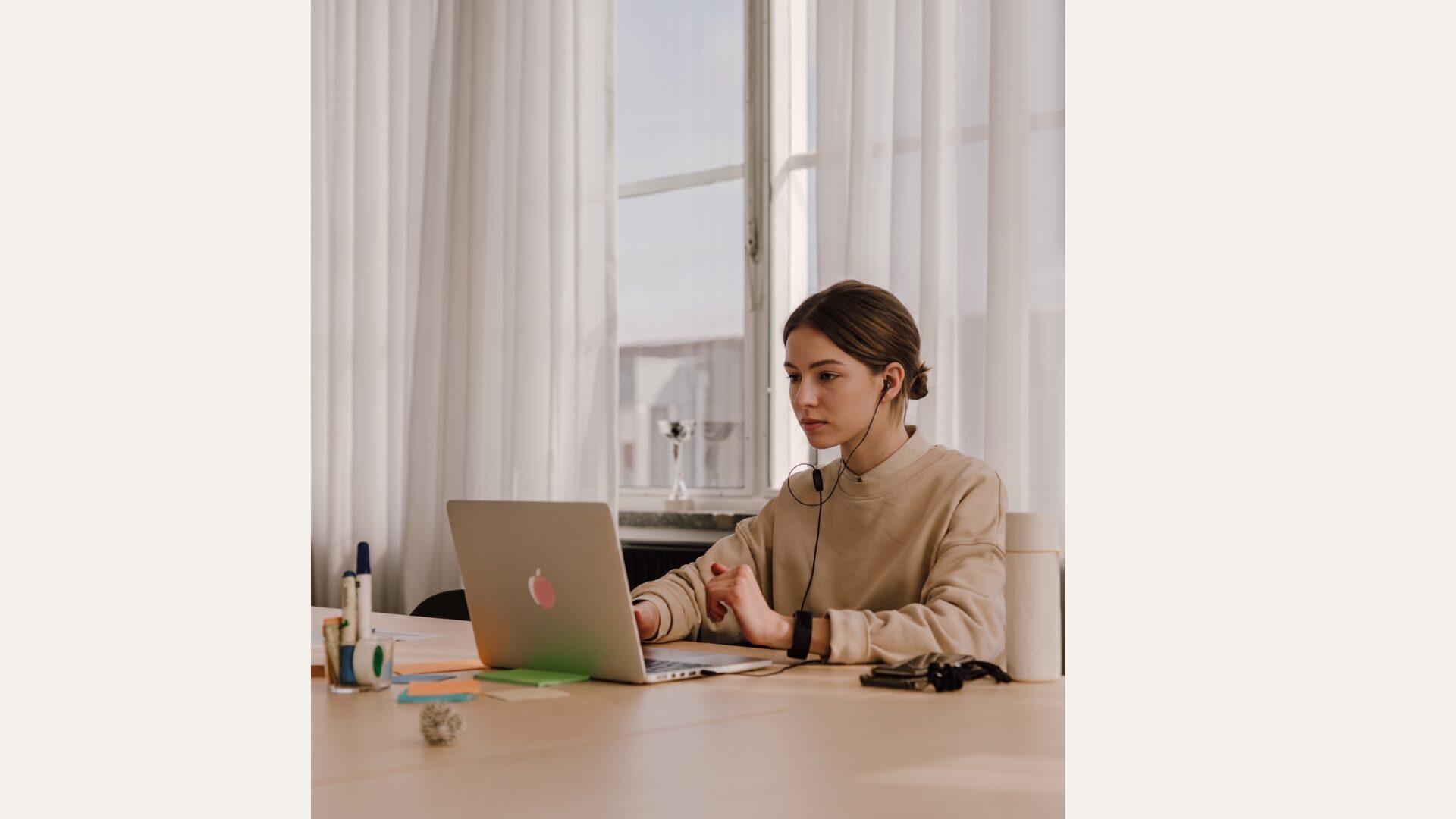 A professional taking a client call at her laptop