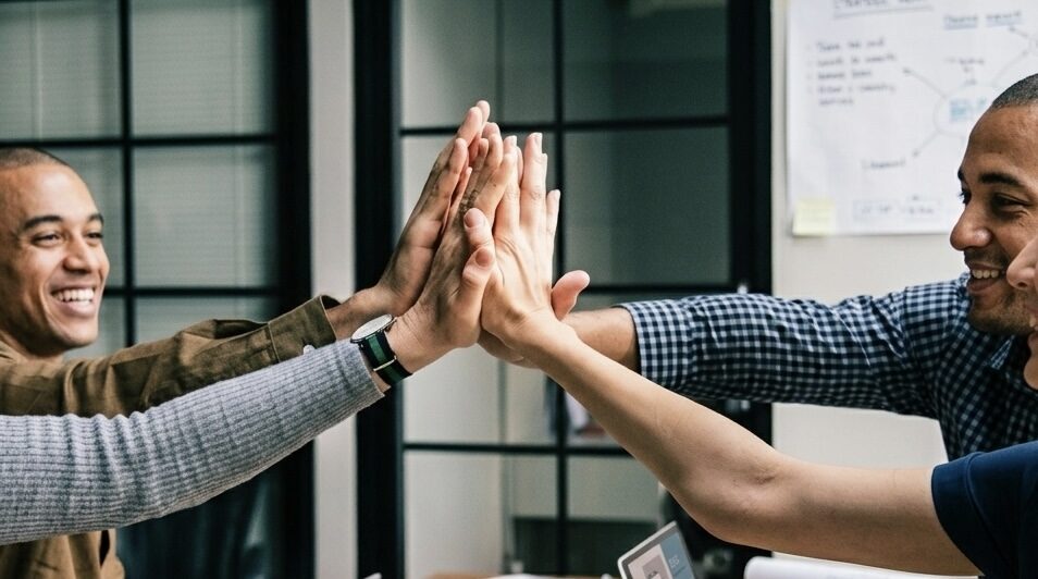 A team celebrating a closed account.